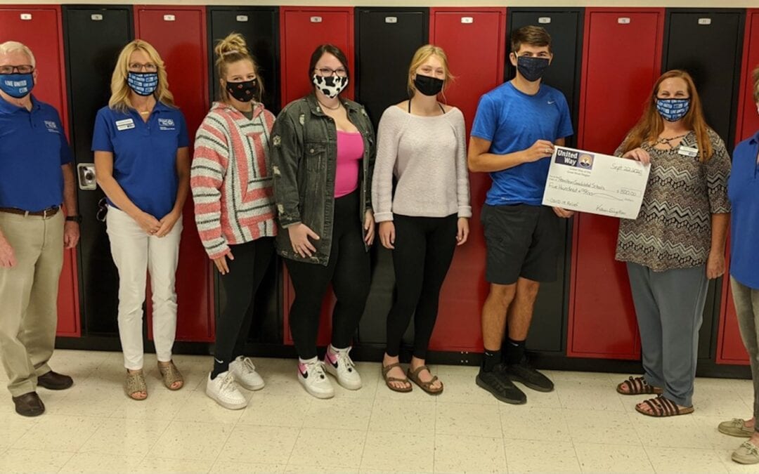 Hamilton CCSD #328 high school students accept a $500 check from United Way of the Great River Region. The funds were made available through a private donation to UWGRR for COVID-19 relief specific to the areas of food insecurity, rent and utility assistance and education. United Way of the Great River Region serves Clark County Missouri, Hancock County Illinois and Lee County Iowa. Pictured left to right: Dave Dion, Tammy Panther, Morgan Perry, Bella Beagles, Josie Radel, Ben Hollis, Karen Siefken and Amy Graham.